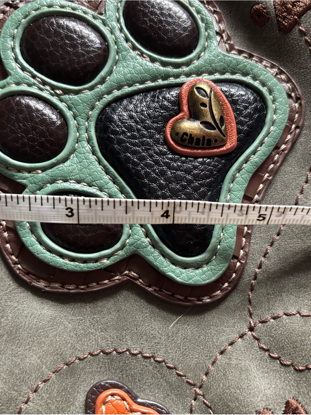 Chala Grey and Brown Paw Print Crossbody Bag - Picture 15 of 16